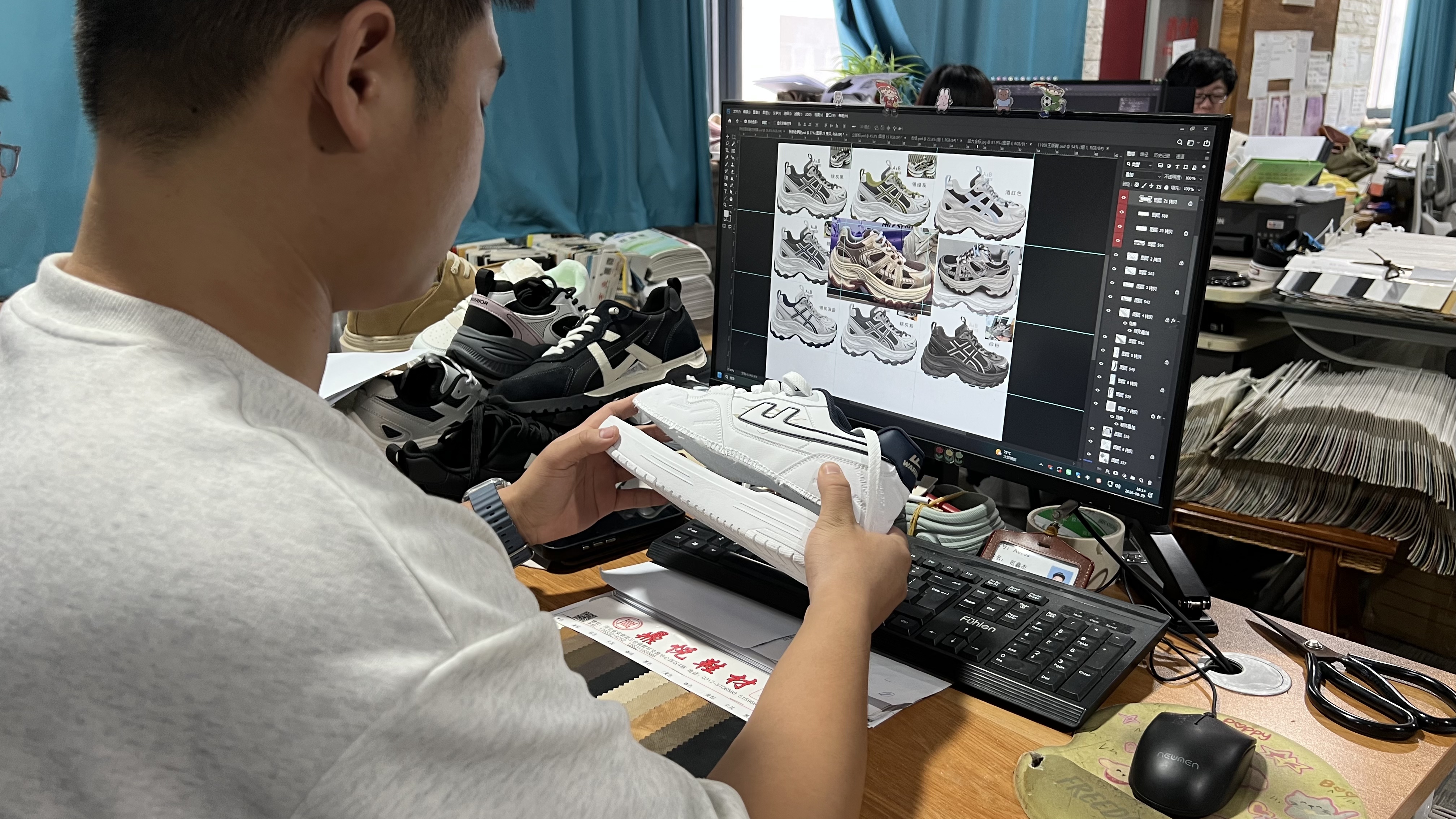 Mingjian designer fitting a sneaker upper to the sole at the development desk