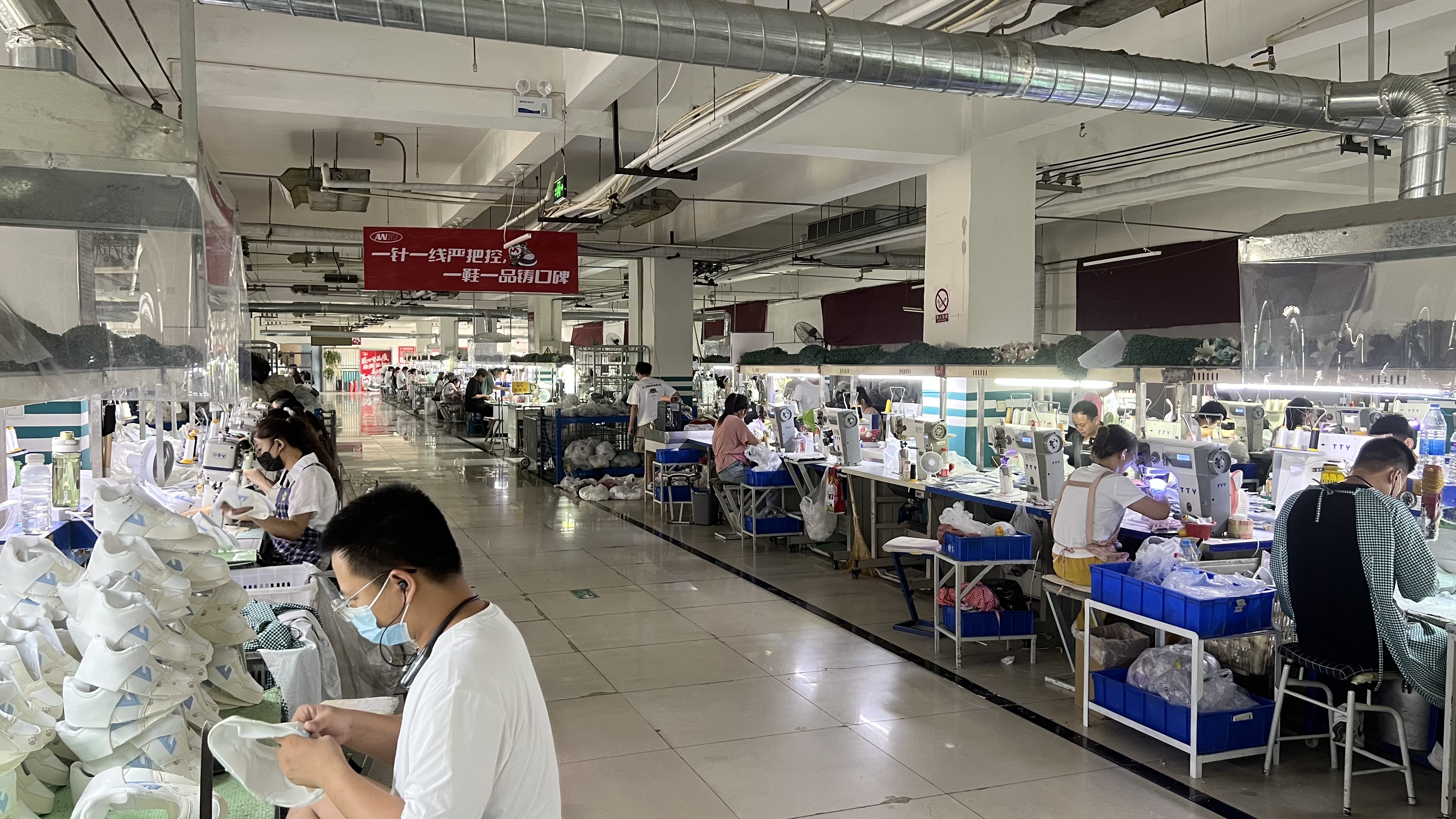 Mingjian sewing line with 1,200+ artisans stitching uppers